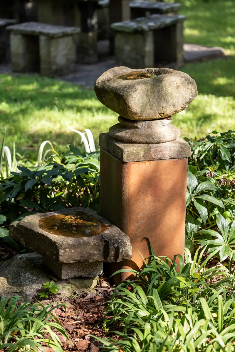 Detail-focused documentary style photography, showcasing the hand-scraped rock birdbaths in the Sutherland family’s Fayetteville garden.