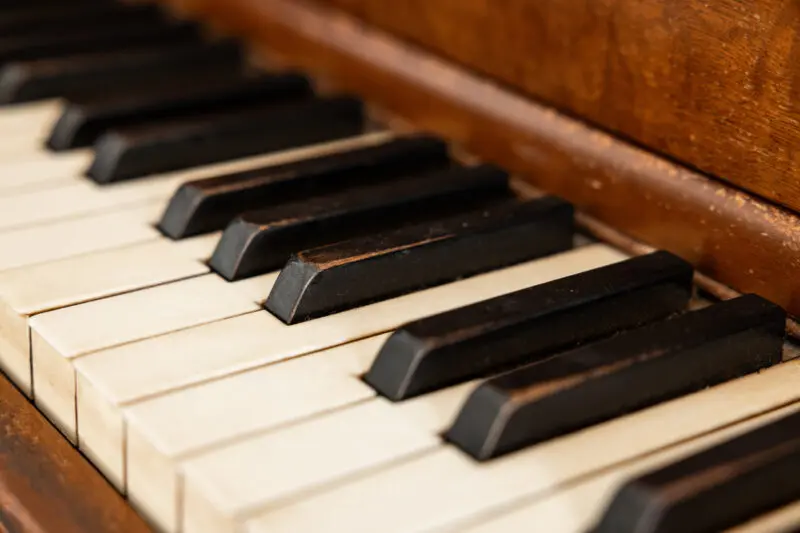 Lifestyle and interior photography in Arkansas, capturing the detail of worn piano keys.