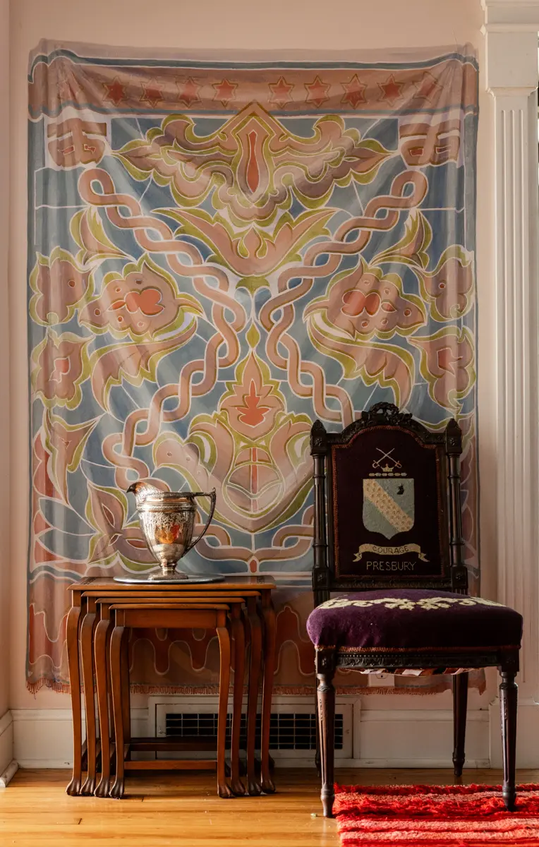 An example of interior photography in Fayetteville, highlighting Martha Sutherland’s hand-painted dining room tapestries and artistic detail.
