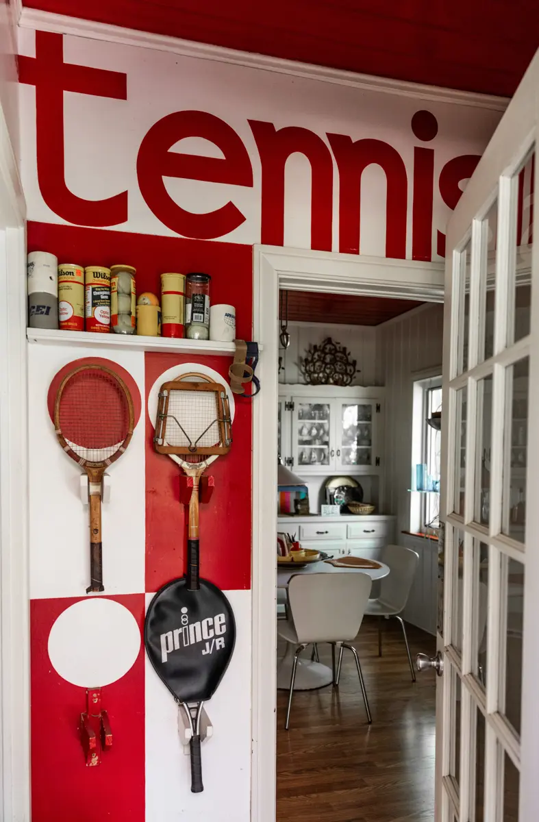 Thoughtful architectural interiors photography in Arkansas, documenting an entrance with hand painted lettering filled with light and personal history.