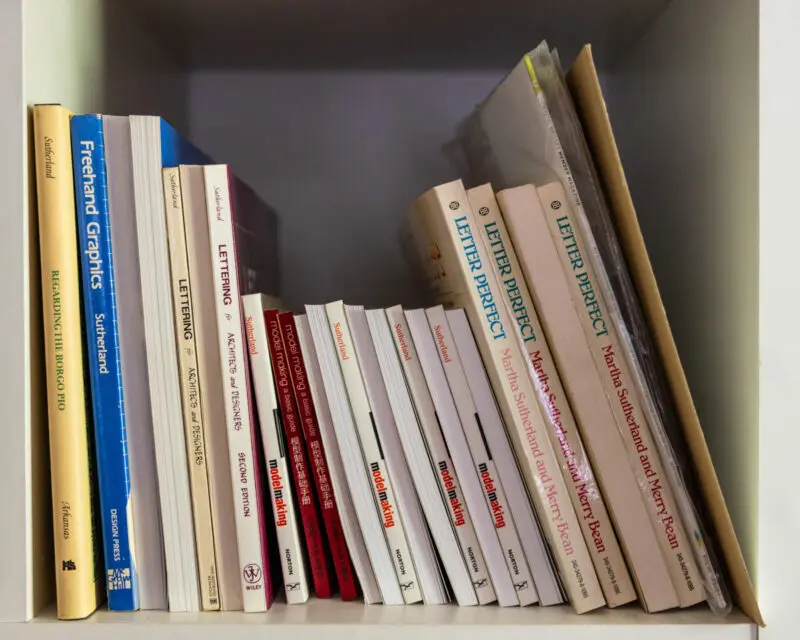 Personal detail photography that complements interior and architecture photography in Fayetteville, showing Martha Sutherland's published books.