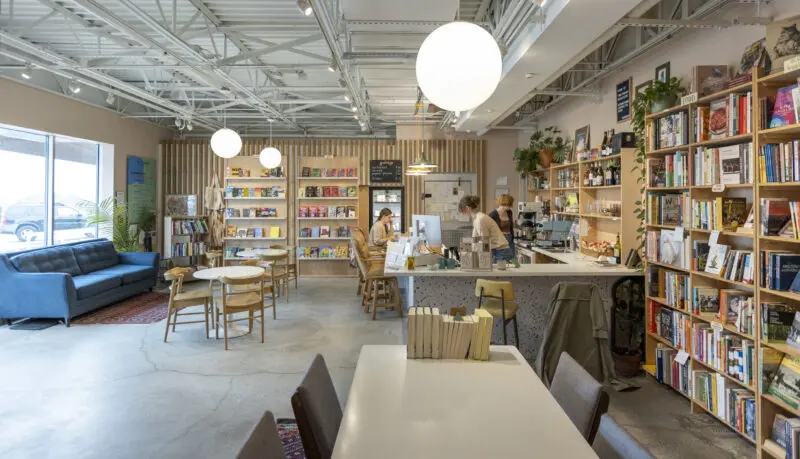 Interior of people sitting at a counter at Two Friends Bookstore in Bentonville, Ark.