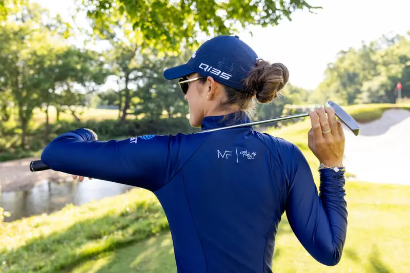 Professional golfer Maria Fassi poses for branding photos on a golf course in Northwest Arkansas.