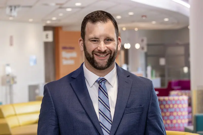 Portrait of an executive at Arkansas Children’s Hospital, photographed in Northwest Arkansas by commercial photographer Beth Hall taken outside the hopital.