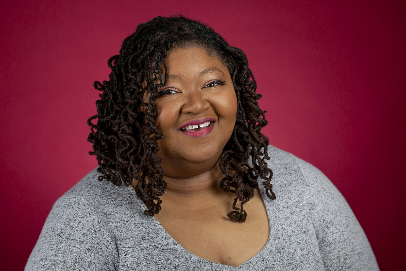 portrait of a Black woman on a red background