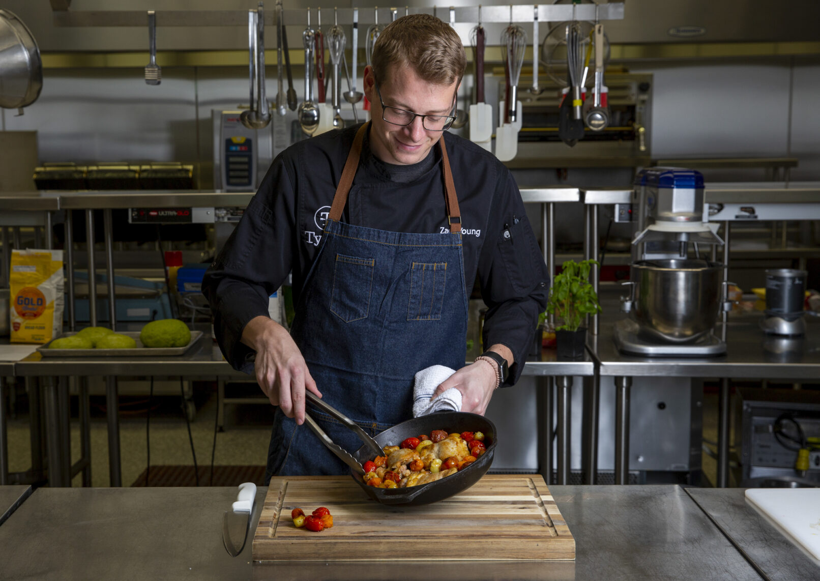 Environmental portrait of a chef cooking vegetables for Tyson Foods