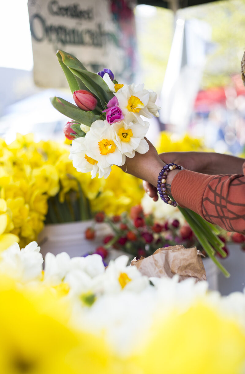 A bouquest of flowers being made at the farmer's market in Fayetteville, Ark.