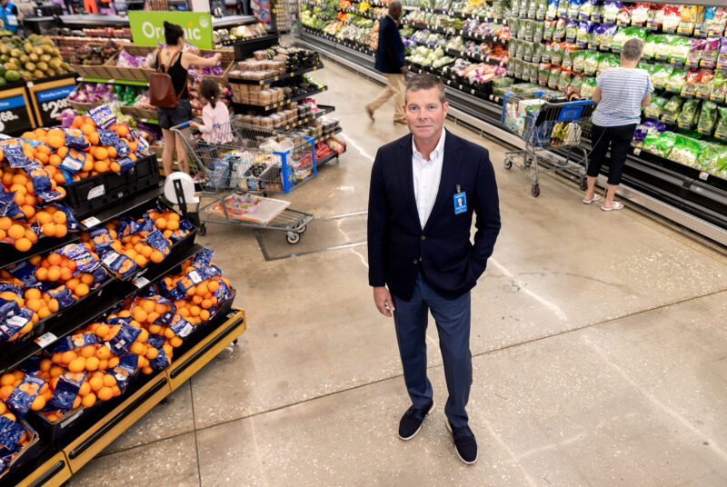 An executive stands in the produce section at a Walmart Supercenter in Bentonville, Ark.