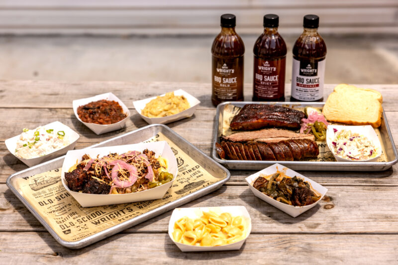 Photo of a meat plate available, sides and bbq sauce at Wrights BBQ in Bentonville.